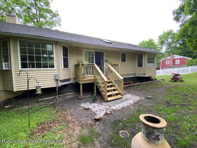 87 Dock St, Saugerties, NY 12477 - back of property with a deck, a chimney, and cooling unit
