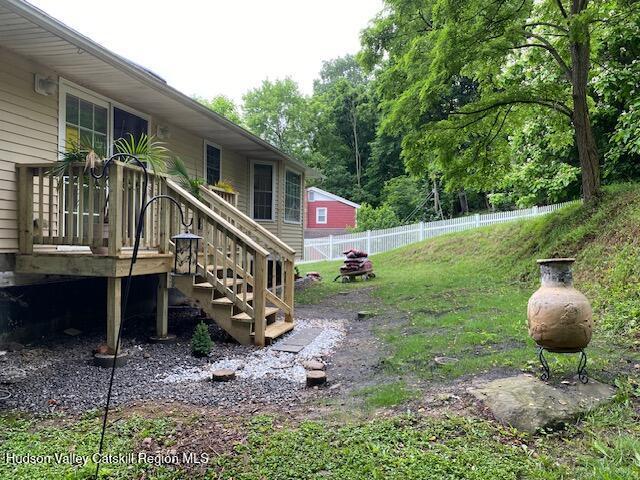 87 Dock St, Saugerties, NY 12477 - view of yard featuring a wooden deck and stairs