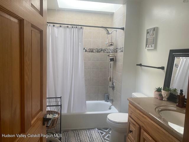 87 Dock St, Saugerties, NY 12477 - full bathroom featuring vanity, toilet, shower / tub combo with curtain, and tile patterned floors