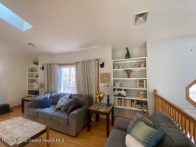 87 Dock St, Saugerties, NY 12477 - living room with wood finished floors and a skylight
