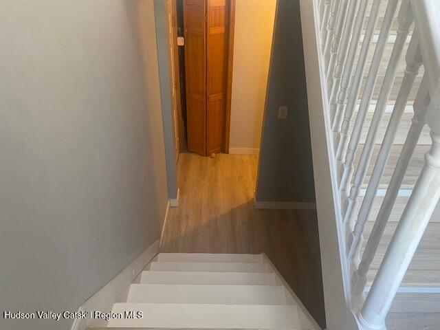 87 Dock St, Saugerties, NY 12477 - stairway with wood finished floors and baseboards