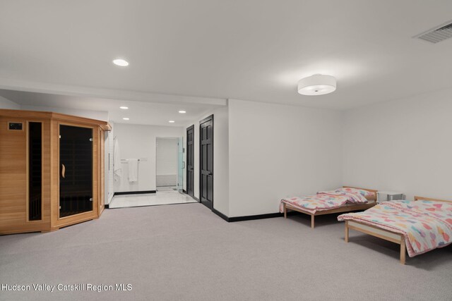 bedroom with light colored carpet