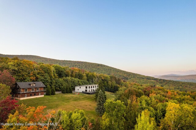 aerial view at dusk featuring a mountain view