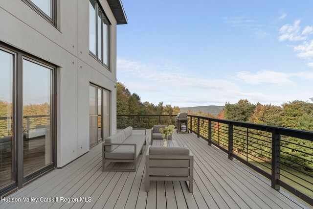 deck featuring outdoor lounge area