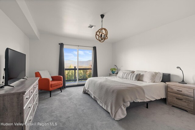 bedroom featuring access to outside and carpet flooring