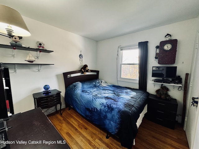 bedroom with wood finished floors