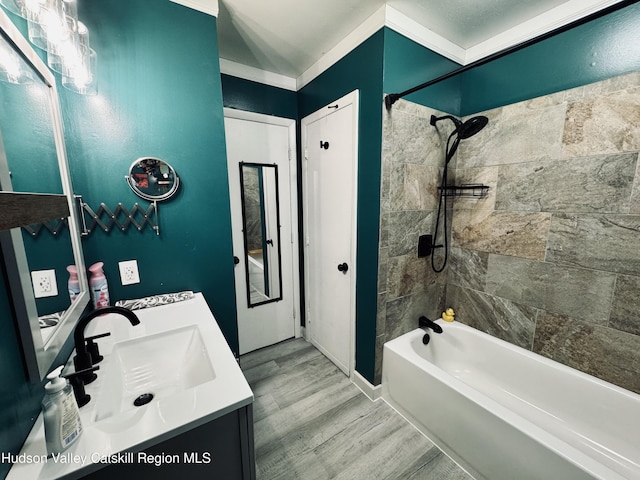 full bath with vanity, shower / bathtub combination, and wood finished floors