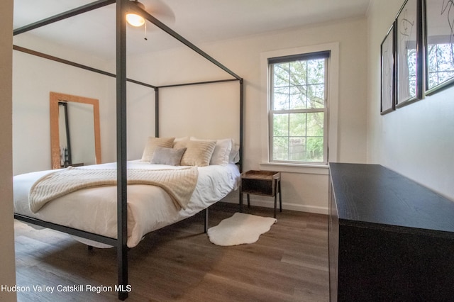 bedroom with wood-type flooring