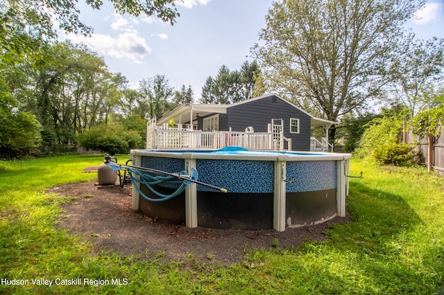 view of pool featuring a yard