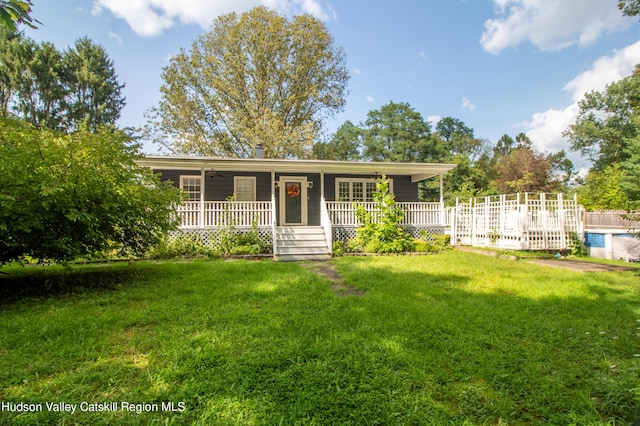 single story home featuring covered porch and a front lawn