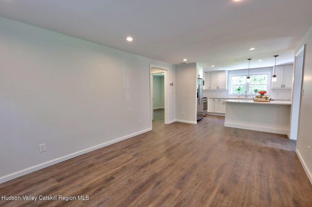 534 Rte 145, Cairo, NY 12413 - unfurnished living room featuring recessed lighting, baseboards, and dark wood-style floors