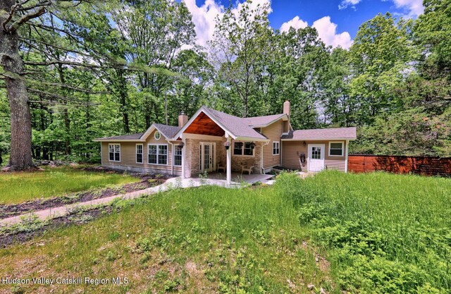 534 Rte 145, Cairo, NY 12413 - view of front facade with a chimney, a patio area, and stone siding