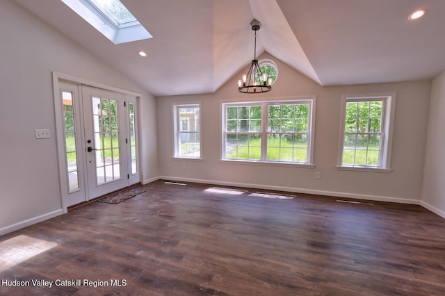 534 Rte 145, Cairo, NY 12413 - spare room featuring vaulted ceiling, a chandelier, baseboards, dark wood finished floors, and a skylight