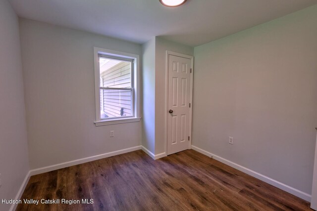 534 Rte 145, Cairo, NY 12413 - unfurnished bedroom with dark wood-style flooring and baseboards