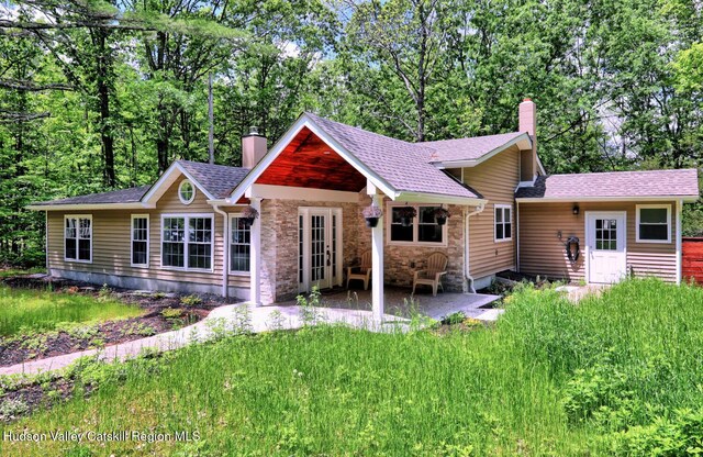 534 Rte 145, Cairo, NY 12413 - back of property with a chimney, a patio area, stone siding, and a shingled roof