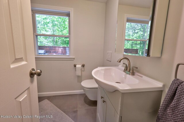534 Rte 145, Cairo, NY 12413 - half bath with plenty of natural light, toilet, vanity, and tile patterned floors