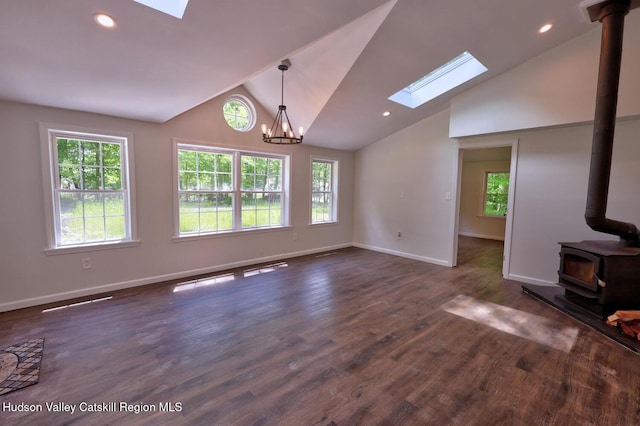 534 Rte 145, Cairo, NY 12413 - unfurnished living room with a skylight, a wood stove, plenty of natural light, vaulted ceiling, and recessed lighting