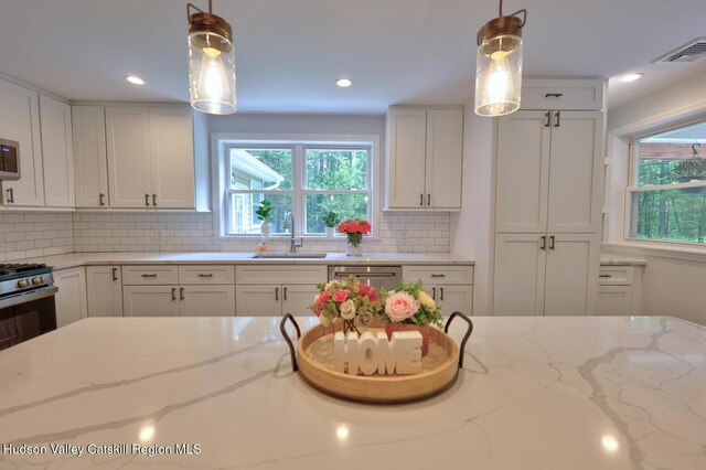 534 Rte 145, Cairo, NY 12413 - kitchen featuring a sink, healthy amount of natural light, white cabinets, and recessed lighting