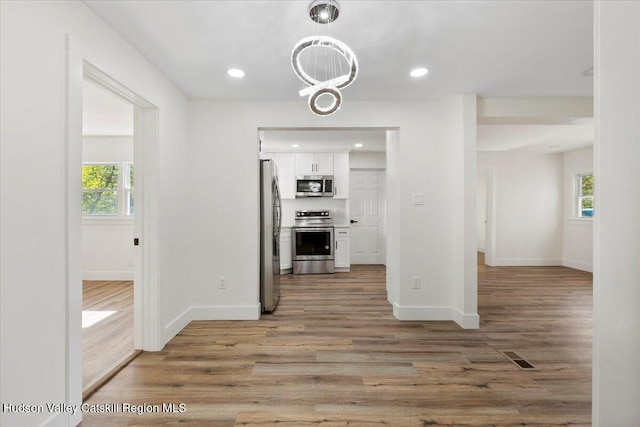 603-607 Old Stage Rd, Saugerties, NY 12477 - interior space featuring baseboards, plenty of natural light, and wood finished floors