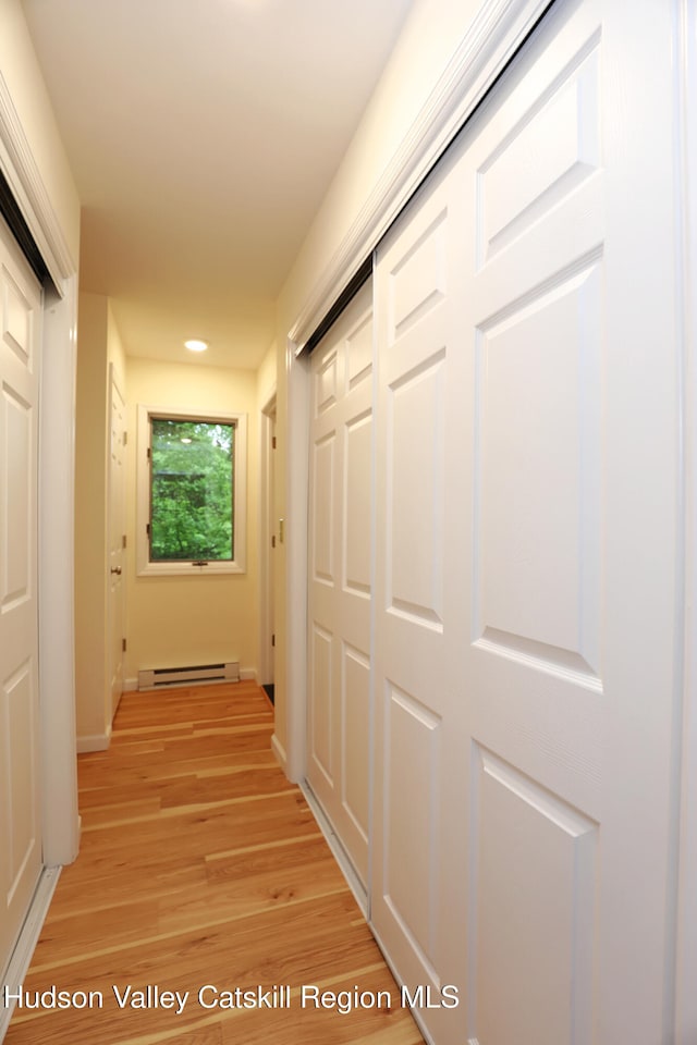 3 Carriage House Ct, Hyde Park, NY 12538 - hallway featuring baseboard heating, light wood finished floors, recessed lighting, and baseboards