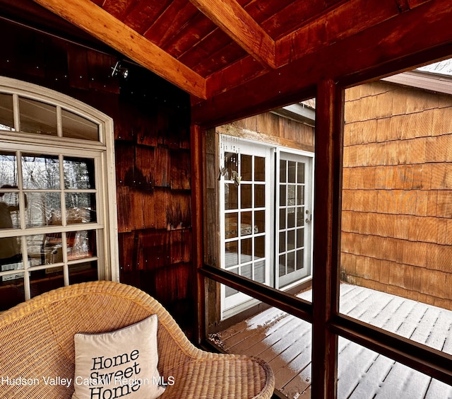 sunroom / solarium with beamed ceiling and wooden ceiling