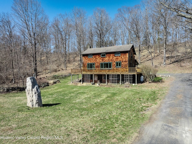 592 County Route 6, High Falls, NY 12440 - view of front facade featuring aphalt driveway, a chimney, a deck, and a front yard