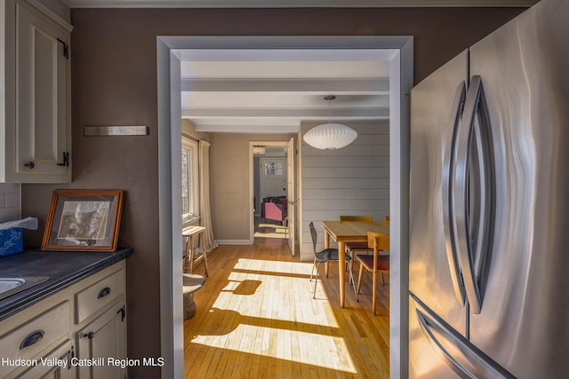 592 County Route 6, High Falls, NY 12440 - kitchen featuring freestanding refrigerator, light wood-style flooring, dark countertops, and beam ceiling