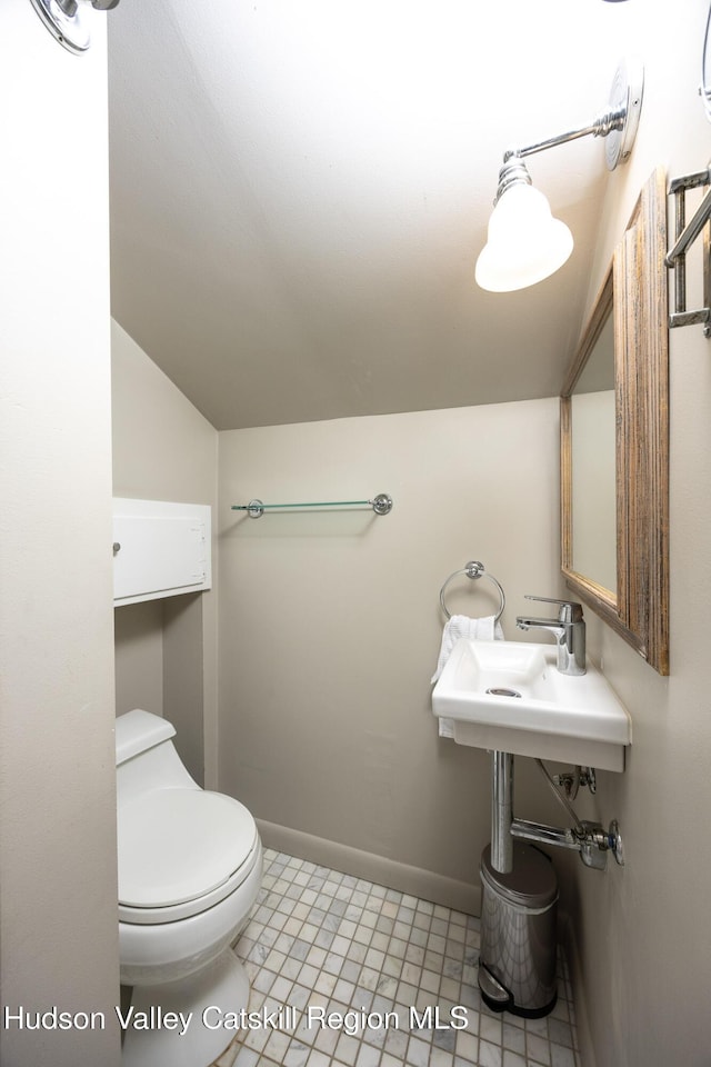 592 County Route 6, High Falls, NY 12440 - bathroom featuring toilet, tile patterned floors, baseboards, and vaulted ceiling