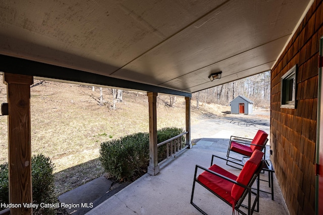 592 County Route 6, High Falls, NY 12440 - view of patio / terrace featuring an outdoor structure and a storage shed
