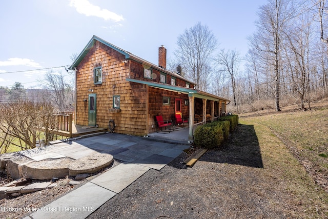 592 County Route 6, High Falls, NY 12440 - exterior space featuring a chimney and a wooden deck