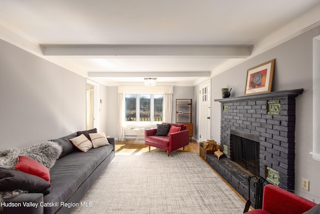 592 County Route 6, High Falls, NY 12440 - living area with beamed ceiling, wood finished floors, a baseboard heating unit, and a brick fireplace