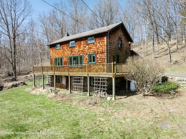 592 County Route 6, High Falls, NY 12440 - back of house featuring a chimney, a deck, and a yard