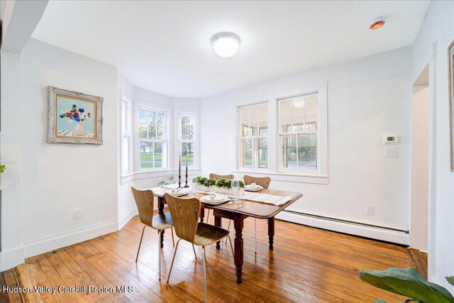 1792 State Route 213, Ulster Park, NY 12487 - dining room with a baseboard heating unit and hardwood / wood-style floors