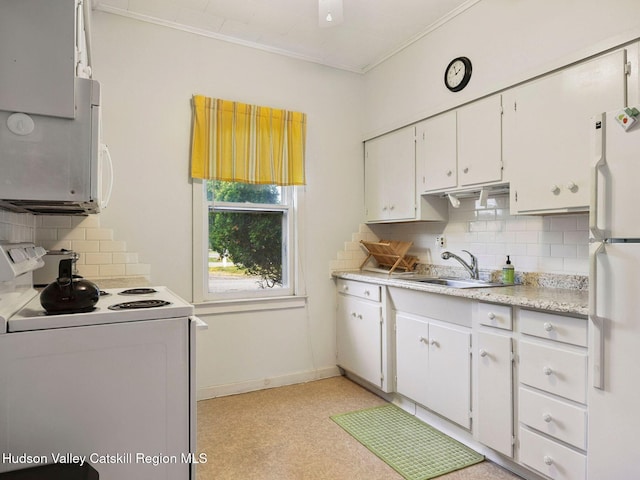 2481 Rte 145, East Durham, NY 12423 - kitchen with white appliances, decorative backsplash, light countertops, white cabinets, and ornamental molding