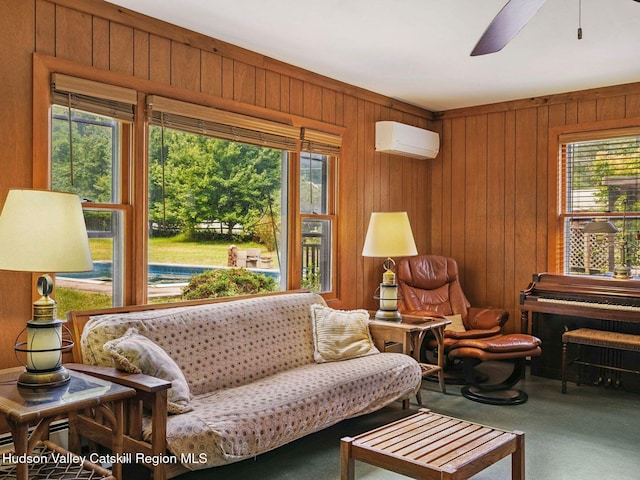 2481 Rte 145, East Durham, NY 12423 - living area with carpet, an AC wall unit, healthy amount of natural light, wood walls, and a ceiling fan