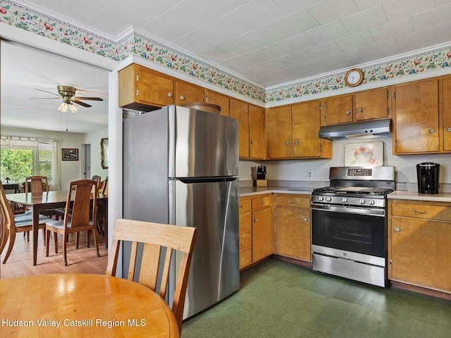 2481 Rte 145, East Durham, NY 12423 - kitchen with appliances with stainless steel finishes, under cabinet range hood, brown cabinetry, light countertops, and a ceiling fan