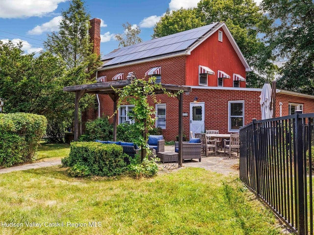 2481 Rte 145, East Durham, NY 12423 - rear view of house with brick siding, a patio, a chimney, and outdoor lounge area