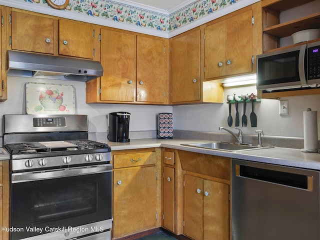 2481 Rte 145, East Durham, NY 12423 - kitchen featuring appliances with stainless steel finishes, under cabinet range hood, light countertops, and brown cabinetry