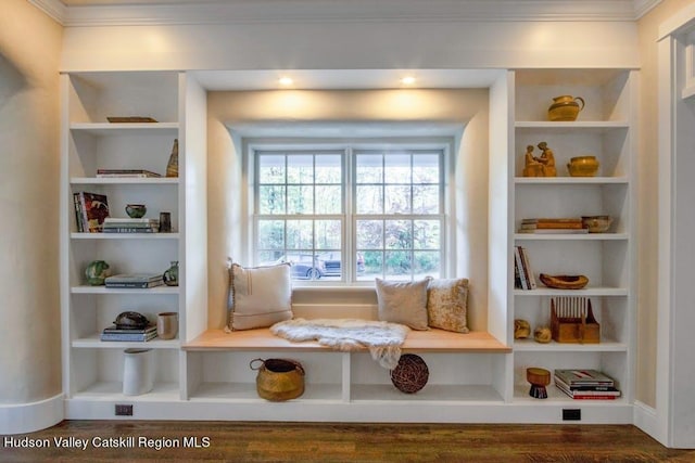 mudroom featuring built in shelves, crown molding, and dark hardwood / wood-style flooring