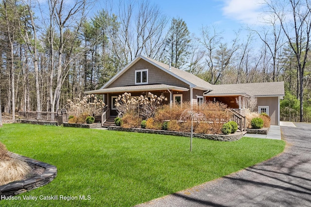 220 John Joy Rd, Woodstock, NY 12498 - view of front of house with covered porch and a front yard