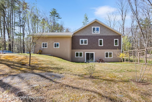 220 John Joy Rd, Woodstock, NY 12498 - back of house featuring a yard and stucco siding