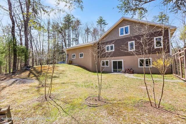 220 John Joy Rd, Woodstock, NY 12498 - back of property featuring a yard and stucco siding