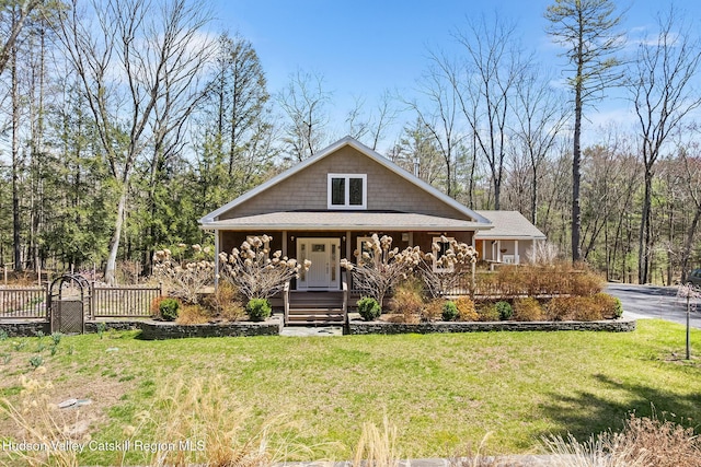 220 John Joy Rd, Woodstock, NY 12498 - view of front facade featuring covered porch and a front lawn