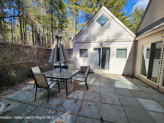 view of patio / terrace with outdoor dining area and fence