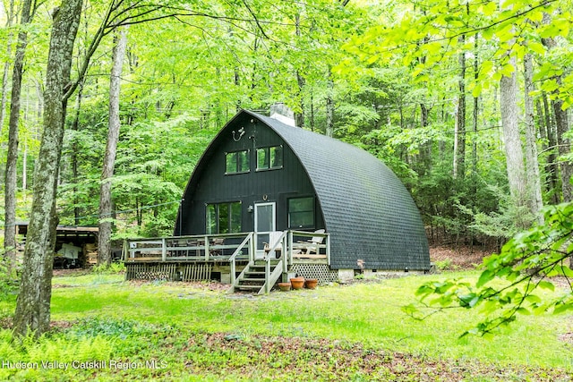 51 Mountain Valley Rd, Boiceville, NY 12412 - a-frame style home with a chimney, a wooden deck, a view of trees, and a gambrel roof