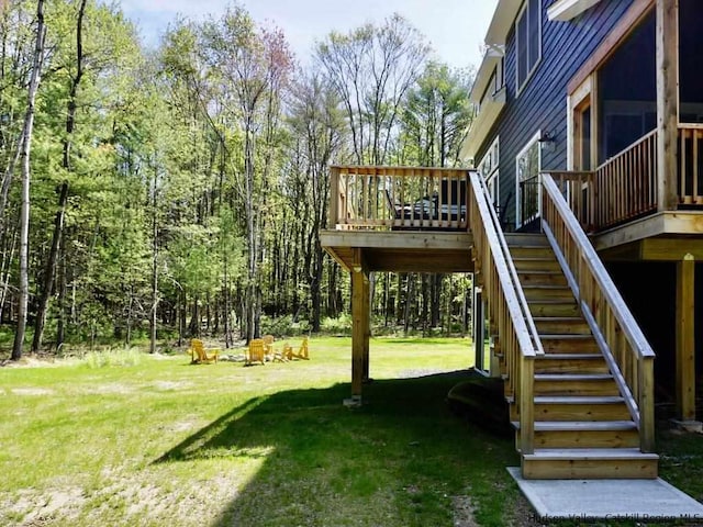 view of yard featuring stairway and a wooden deck