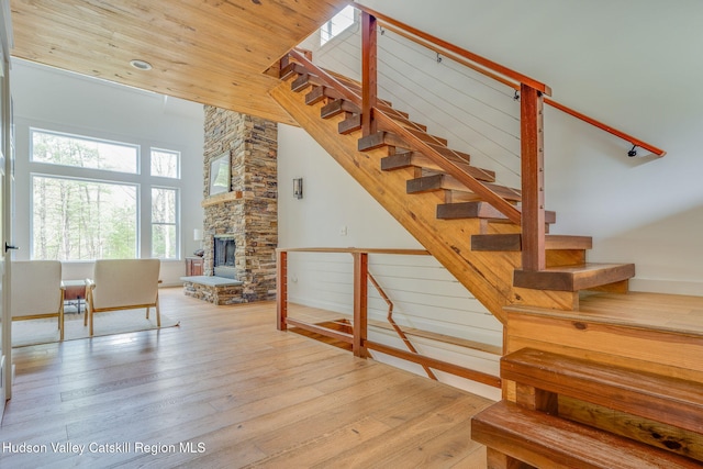 51 Houtman Rd, Saugerties, NY 12477 - staircase with a stone fireplace and wood finished floors