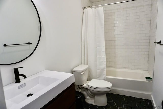 bathroom featuring vanity, tile patterned floors, shower / bath combo, and toilet