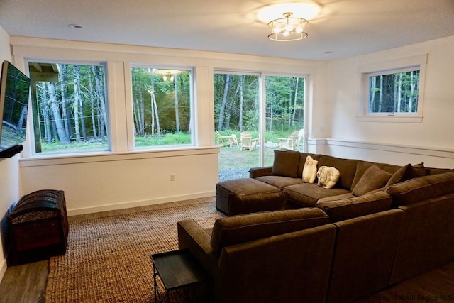 living area featuring baseboards