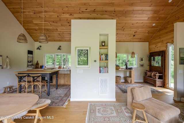 129 Krum Rd, Kerhonkson, NY 12446 - dining area featuring healthy amount of natural light, wood finished floors, wooden ceiling, high vaulted ceiling, and baseboards